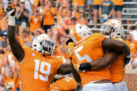 Tennessee Volunteers linebacker Darrell Taylor (19) and defensive lineman Kyle Phillips (5) celebrate with linebacker Darrin Kirkland Jr. (34) after he returned a interception for a touchdown against the East Tennessee State Buccaneers during the second quarter at Neyland Stadium. (Randy Sartin-USA TODAY Sports)