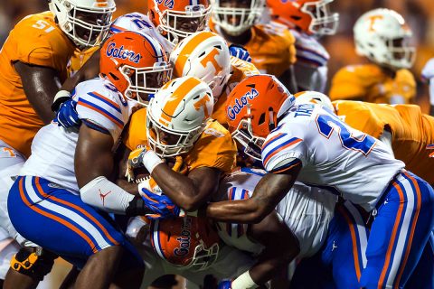 Tennessee Volunteers running back Ty Chandler (8) is stopped by a host of Florida Gators in the second quarter of a game at Neyland Stadium. (Bryan Lynn-USA TODAY Sports)