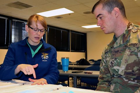 1st Lt. Megan Smith instructs Pfc. Shane Sheffield of Young Eagle Medical Home on administering a digital nerve block at monthly medic training. Physician assistants are responsible for training their medics, so Blanchfield's IPAP Phase II directors incorporate medic training under the supervision of their instructors to prepare the future physician assistants. (U.S. Army photo by Maria Yager) 1st Lt. Megan Smith instructs Pfc. Shane Sheffield of Young Eagle Medical Home on administering a digital nerve block at monthly medic training. Physician assistants are responsible for training their medics, so Blanchfield's IPAP Phase II directors incorporate medic training under the supervision of their instructors to prepare the future physician assistants. (U.S. Army photo by Maria Yager)