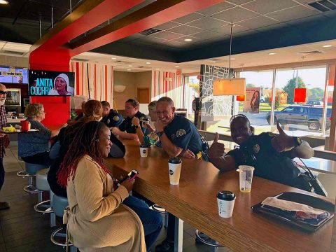 Clarksville Police Officers talking with McDonald's customers on National Coffee with a Cop Day.