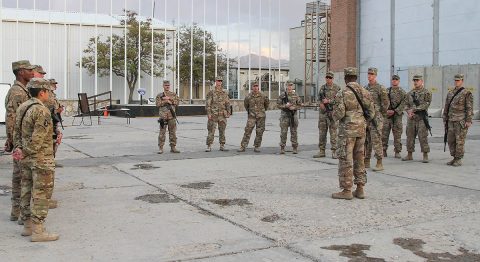 Sergeant 1st Class Billy Scott (center), the sustainment automation support management office noncommissioned officer in charge for the 101st Resolute Support Sustainment Brigade, gathers all of the Junior Leadership Course candidates and their sponsors together to brief them on conducting the Soldier’s Manual of Common Tasks challenge on Bagram Airfield, Afghanistan, Sept. 27, 2018. (SSG Caitlyn Byrne, 101st Sustainment Brigade PAO) 