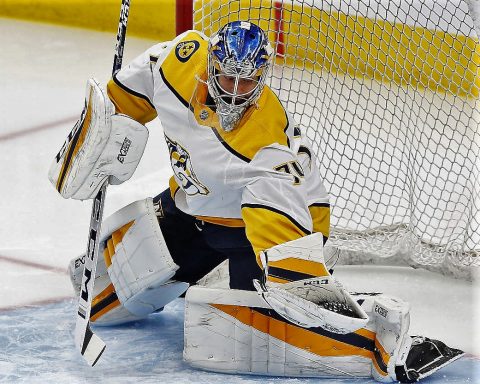 Nashville Predators goaltender Juuse Saros (74) makes a save during warm ups prior to the game against the Edmonton Oilers at Rogers Place. (Perry Nelson-USA TODAY Sports)