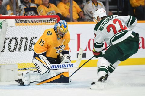 Nashville Predators goaltender Pekka Rinne (35) makes a save on a shot by Minnesota Wild right wing Nino Niederreiter (22) during the third period at Bridgestone Arena. Mandatory Credit: Christopher Hanewinckel-USA TODAY Sports