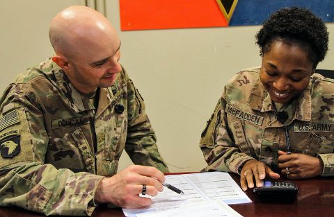Major Jeremy Duncan, a signal officer, and North Carolina native teaches budgeting fundamentals to Sergeant Latoya McFadden, a culinary specialist assigned to the 101st Resolute Support Sustainment Brigade. Major Duncan is the primary instructor for the 9-week financial management course at Bagram Airfield, Afghanistan. (U.S. Army photo by Spc. Alexes Anderson) 
