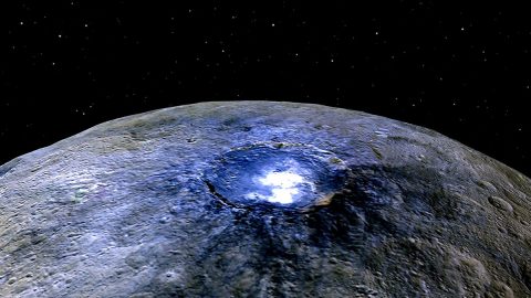 This representation of Ceres' Occator Crater in false colors shows differences in the dwarf planet's surface composition. (NASA/JPL-Caltech/UCLA/MPS/DLR/IDA)