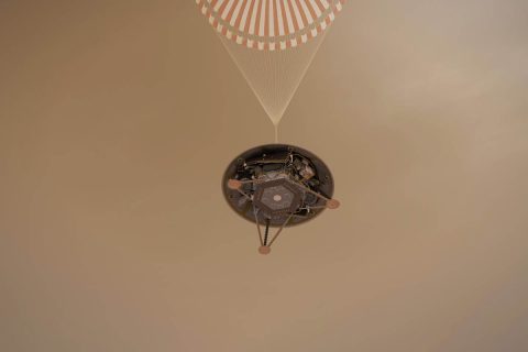 This illustration shows a simulated view of NASA's InSight lander descending on its parachute toward the surface of Mars. (NASA/JPL-Caltech)