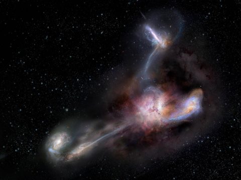 This artist's impression shows galaxy WISE J224607.55-052634.9, the most luminous galaxy ever discovered. A new study using data from the Atacama Large Millimeter/submillimeter Array (ALMA) shows that this galaxy is syphoning dust and other material from three of its smaller galactic neighbors. )(NRAO/AUI/NSF) S. Dagnello)