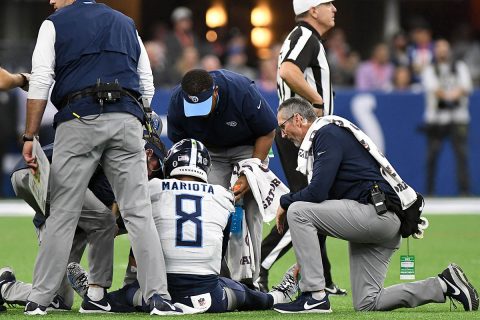 Tennessee Titans quarterback Marcus Mariota (8) is examined after being sacked in the first half by Indianapolis Colts defensive end Tyquan Lewis (not pictured) at Lucas Oil Stadium. Mandatory (Thomas J. Russo-USA TODAY Sports)