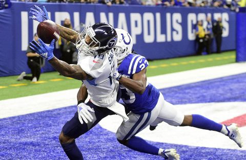 Tennessee Titans receiver Tajae' Sharpe (19) makes a diving catch for a touchdown over Indianapolis Colts corner back Kenny Moore II (23) in the second half at Lucas Oil Stadium on November 18th, 2018. 