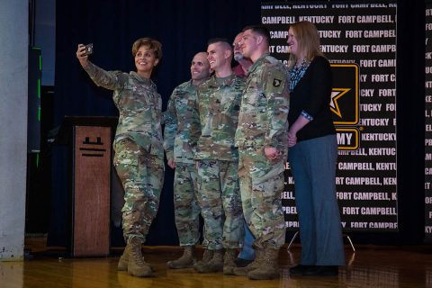 At a Fort Campbell community town hall, Lt. Gen. Nadja West, U.S. Army surgeon general and commander of Army Medical Command, takes a selfie with Soldiers and Army Civilians after presenting coins for individual accomplishments. (U.S. Army photo by David E. Gillespie)