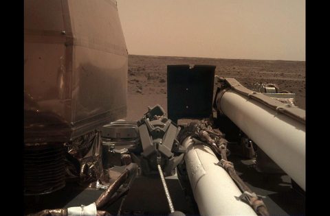 As visible in this two-frame set of images, NASA's InSight spacecraft unlatched its robotic arm on Nov. 27, 2018, the day after it landed on Mars. (NASA/JPL-Caltech)