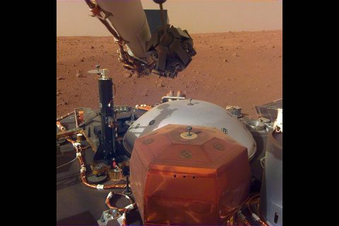 This image from InSight's robotic-arm mounted Instrument Deployment Camera shows the instruments on the spacecraft's deck, with the Martian surface of Elysium Planitia in the background. The image was received on Dec. 4, 2018 (Sol 8). (NASA/JPL-Caltech)