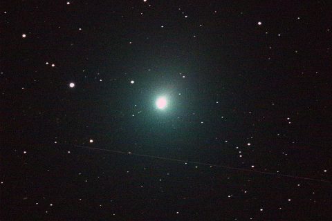 This 120 second image of the comet was taken Dec. 2 by an iTelescope 50 mm refractor located at an observatory near Mayhill, New Mexico. The streak below the comet was produced by a rocket body (upper stage) passing through the telescope's field of view during the exposure. (NASA) This 120 second image of the comet was taken Dec. 2 by an iTelescope 50 mm refractor located at an observatory near Mayhill, New Mexico. The streak below the comet was produced by a rocket body (upper stage) passing through the telescope's field of view during the exposure. (NASA)