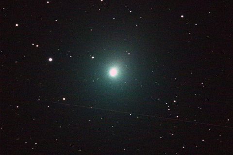 This 120 second image of the comet was taken Dec. 2 by an iTelescope 50 mm refractor located at an observatory near Mayhill, New Mexico. The streak below the comet was produced by a rocket body (upper stage) passing through the telescope's field of view during the exposure. (NASA)