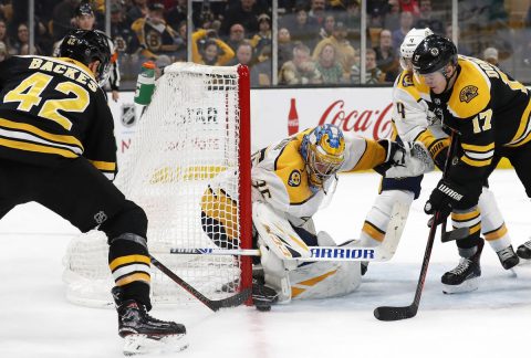 Boston Bruins right wing David Backes (42) and center Ryan Donato (17) fight for a loose puck at the post against Nashville Predators goaltender Pekka Rinne (35) during the second period at TD Garden. (Winslow Townson-USA TODAY Sports)