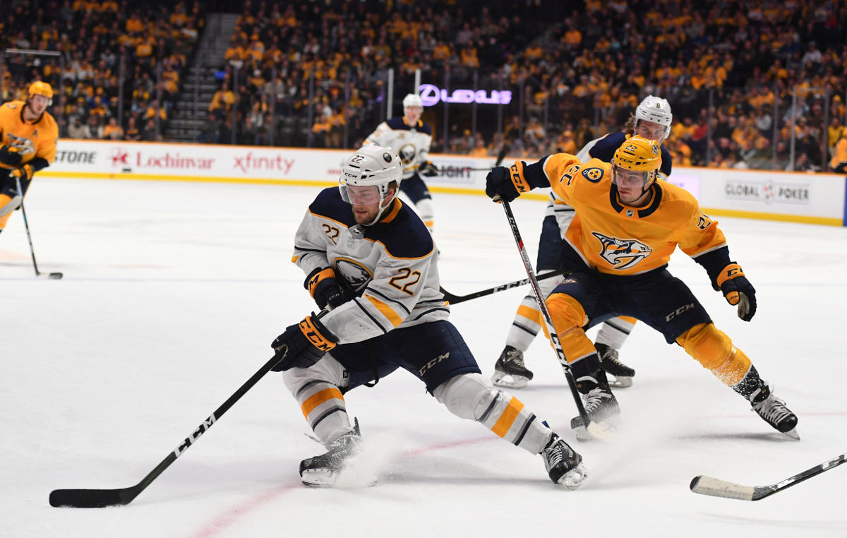 Dec 3, 2018; Nashville, TN, USA; Buffalo Sabres center Johan Larsson (22) handles the puck away from Nashville Predators left wing Kevin Fiala (22) during the second period at Bridgestone Arena. Mandatory Credit: Christopher Hanewinckel-USA TODAY Sports Dec 3, 2018; Nashville, TN, USA; Buffalo Sabres center Johan Larsson (22) handles the puck away from Nashville Predators left wing Kevin Fiala (22) during the second period at Bridgestone Arena. Mandatory Credit: Christopher Hanewinckel-USA TODAY Sports