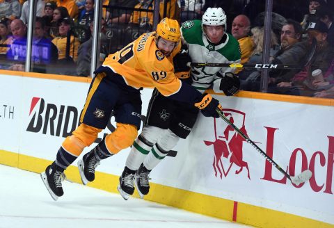 Nashville Predators center Frederick Gaudreau (89) hits /Dallas Stars defenseman Miro Heiskanen (4) during the first period at Bridgestone Arena. (Christopher Hanewinckel-USA TODAY Sports)