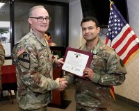 Hospital Commander, Col. Anthony McQueen presents Staff Sgt. Robert Baker, a combat medic specialist assigned as NCOIC of the hospital’s Mother Baby Unit, with the Army Commendation Medal for Baker’s selection as Blanchfield Army Community Hospital Non-Commissioned Officer of the Year at an award ceremony Jan. 17. (U.S. Army photo by Maria Yager)