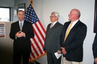 Clarksville Mayor Joe Pitts, joined by Executive Director Rory Mallory, and Robertson County Mayor Billy Vogle, speaks Tuesday at a gathering celebrating Fort Campbell Strong’s first year and dedicating its new offices.