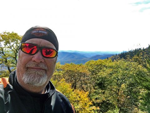 Hank with his Motorcycle in the Mountains Hank with his Motorcycle in the Mountains
