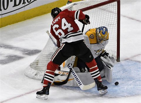 Nashville Predators goaltender Pekka Rinne (35) makes a save on Chicago Blackhawks center David Kampf (64) during the first period at United Center. (David Banks-USA TODAY Sports)