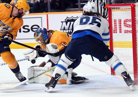 Nashville Predators goaltender Pekka Rinne (35) makes a save on a shot by Winnipeg Jets left wing Mathieu Perreault (85) during the second period at Bridgestone Arena. (Christopher Hanewinckel-USA TODAY Sports)