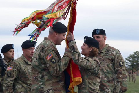 Lt. Gen. Laura Richardson, acting commanding general for U.S. Forces Command, hands the "Screaming Eagle" colors to Maj. Gen. Brian Winski, as he assumes command of the 101st Airborne Division (Air Assault), Feb. 14, at Fort Campbell, Kentucky. Winski succeeds Maj. Gen. Andrew Poppas, who, after commanding the world's only air assault division for the past two years, will move on to the Pentagon, as the director of operations for the Joint Staff. (Sgt. James Griffin, 1st Brigade Combat Team, 101st Airborne Division Public Affairs) 