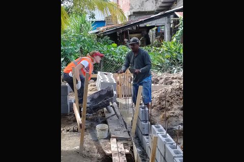 Emily Moore, a PELP junior and Austin Peay State University softball player, works with the construction supervisor at a Habitat site. (APSU)