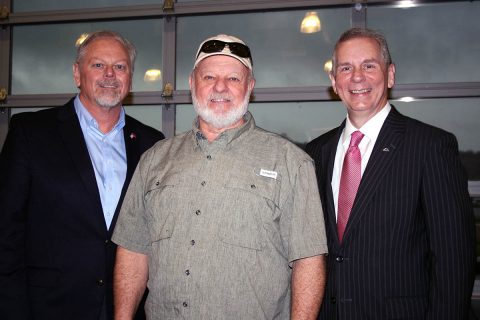 Eddie Combs, a 45-year employee at CDE Lightband, is congratulated Wednesday by CDE General Manager Brian Taylor, left, and Clarksville Mayor Joe Pitts. The City of Clarksville presented service pins to more than 200 workers at its annual employee awards breakfast.