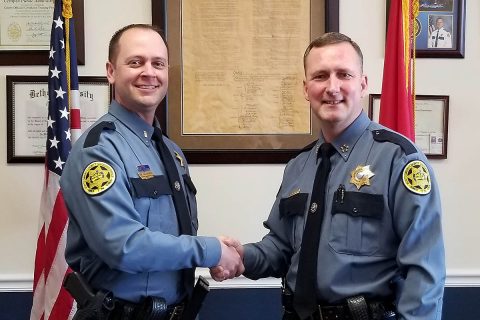 Montgomery County Sheriff John Fuson (L) congratulates Mark Wojnarek (R) on his promotion to Lieutenant.