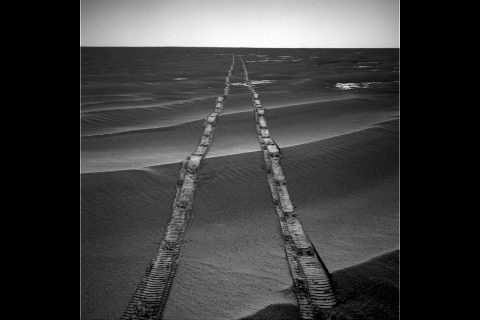 In this navigation camera raw image, NASA's Opportunity Rover looks back over its own tracks on Aug. 4, 2010. NASA's Jet Propulsion Laboratory, a division of Caltech in Pasadena, manages the Mars Exploration Rover Project for NASA's Science Mission Directorate, Washington.