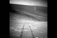 From its perch high on a ridge, NASA’s Mars Exploration Rover Opportunity recorded this image of a Martian dust devil twisting through the valley below. (NASA/JPL-Caltech)