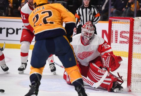 Feb 12, 2019; Nashville, TN, USA; Detroit Red Wings goaltender Jimmy Howard (35) makes a save on a shot by Nashville Predators left wing Kevin Fiala (22) during the first period at Bridgestone Arena. Mandatory Credit: Christopher Hanewinckel-USA TODAY Sports