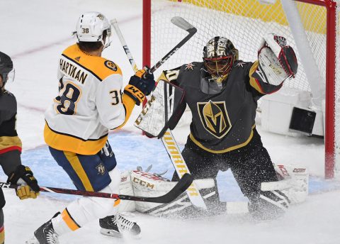 Feb 16, 2019; Las Vegas, NV, USA; Vegas Golden Knights goaltender Malcolm Subban (30) gloves the puck as Nashville Predators right wing Ryan Hartman (38) looks for a rebound during the first period at T-Mobile Arena. Mandatory Credit: Stephen R. Sylvanie-USA TODAY Sports