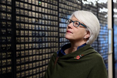 Helen Ayer Patton, granddaughter of the legendary Gen. George S. Patton, Jr., who commanded the U.S. Third Army in France and Germany following the Allied invasion of Normandy, takes time to read the names of fallen Soldiers at the Screaming Eagle Memorial Aerie inside the 101st Airborne Division (Air Assault) headquarters during her visit to Fort Campbell, Feb. 25. (Sgt. James Griffin, 1st Brigade Combat Team Public Affairs) 