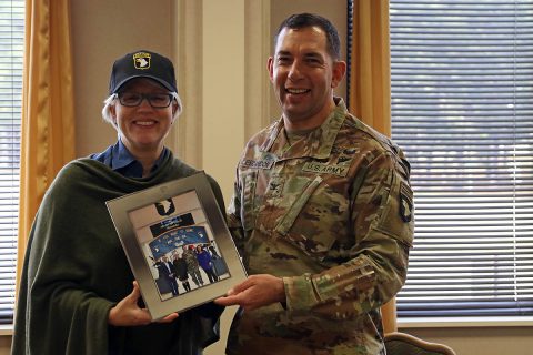 Col. Joseph E. Escandon, 2nd Brigade Combat Team, 101st Airborne Division (Air Assault) commander, presents Helen Ayer Patton, granddaughter of the famed Gen. George S. Patton, Jr. who commanded the U.S. Third Army in France and Germany following the Allied invasion of Normandy, with a framed photo commemorating her visit to Fort Campbell, Feb. 25. (Sgt. James Griffin, 1st Brigade Combat Team Public Affairs) 