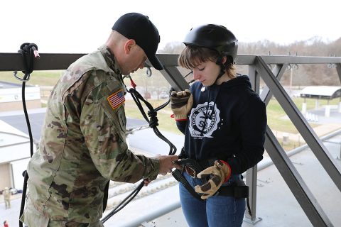 Staff Sgt. Brett Feller, an instructor at The Sabalauski Air Assault School, secures a harness for French student, Manon Quemar, to assist with her first rappel, March 12, at Fort Campbell, Kentucky. Quemar is visiting Fort Campbell as part of the “Memory and Gratitude Tour” organized by her history teacher, Patrick Fissot. The tour celebrates the day the 101st Airborne Division liberated Carentan from Nazi-GeStaff Sgt. Brett Feller, an instructor at The Sabalauski Air Assault School, secures a harness for French student, Manon Quemar, to assist with her first rappel, March 12, at Fort Campbell, Kentucky. Quemar is visiting Fort Campbell as part of the “Memory and Gratitude Tour” organized by her history teacher, Patrick Fissot. The tour celebrates the day the 101st Airborne Division liberated Carentan from Nazi-German Forces in 1944. (Sgt. 1st Class Katrina Craig) rman Forces in 1944. (Sgt. 1st Class Katrina Craig) 