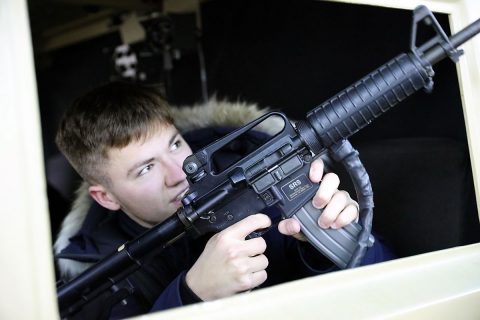 Galvin Caillowey, a French student visiting Fort Campbell, virtually experiences an Afghanistan convoy in the Reconfigurable Vehicle Tactical Convoy Trainer Simulator, March 12. Caillowey and 29 other students from Lycee Sivard de Beaulieu High School, Carentan, France, visited with 101st Airborne Division (Air Assault) Soldiers as part of the “Memory and Gratitude Tour,” which honors the day the 101st Airborne Division liberated Carentan from Nazi-German forces, in 1944. (Sgt. 1st Class Katrina Craig) 