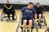 (L to R) Staff Sgt. Kenneth Arnold, Sgt. 1st Class Ian Crawley, and Sgt. 1st Class Joseph Fontenot, all assigned to Fort Campbell’s Warrior Transition Battalion, practice moving down the court during a round of wheelchair basketball at Shaw Gym Feb. 28. The Soldiers will be competing in the Army Trials at Fort Bliss, Texas, this week, to earn a spot on Team Army for the 2019 Warrior Games later this year. (U.S. Army photo by Maria Yager)