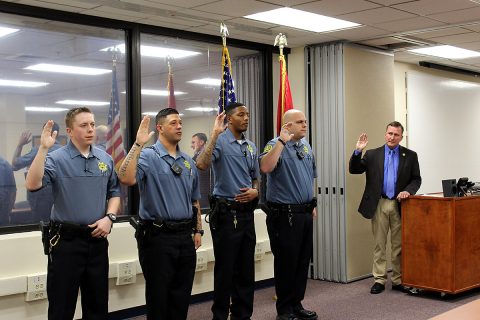 Montgomery County Sheriff John Fuson swears in Andrew Brown, Tyler Cunningham, Dexter Pendleton-Clark, and Joshua Williams.