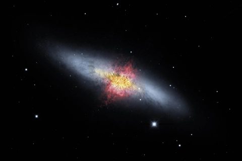 The magnetic field lines of the the Cigar Galaxy (also called M82) appear in this composite image. The lines follow the bipolar outflows (red) generated by exceptionally high rates of star formation. (NASA/SOFIA/E. Lopez-Rodiguez; NASA/Spitzer/J. Moustakas et al)