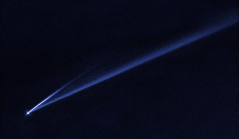 This Hubble Space Telescope image reveals the gradual self-destruction of an asteroid, whose ejected dusty material has formed two long, thin, comet-like tails. The longer tail stretches more than 500,000 miles (800,000 kilometers) and is roughly 3,000 miles (4,800 kilometers) wide. The shorter tail is about a quarter as long. The streamers will eventually disperse into space. (NASA, ESA, K. Meech and J. Kleyna (University of Hawaii), and O. Hainaut (European Southern Observatory))