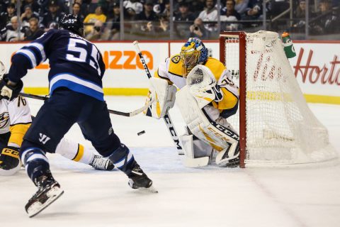 Winnipeg Jets forward Mark Scheifele (55) scores a goal past Nashville Predators goalie Pekka Rinne (35) during the second period at Bell MTS Place. (Terrence Lee-USA TODAY Sports)