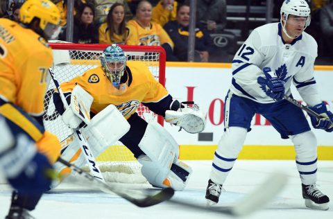 Nashville Predators goaltender Pekka Rinne (35) watches the puck behind Toronto Maple Leafs center Patrick Marleau (12) during the first period at Bridgestone Arena. Mandatory Credit: Christopher Hanewinckel-USA TODAY Sports