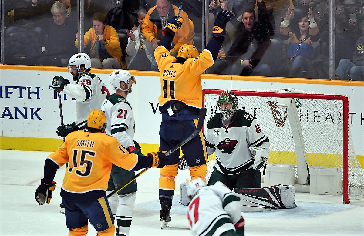 Mar 5, 2019; Nashville, TN, USA; (Editors Note: Corrected Caption) Nashville Predators center Brian Boyle (11) celebrates in front of Minnesota Wild goaltender Devan Dubnyk (40) after scoring a goal during the second period at Bridgestone Arena. The goal was originally credited to Nashville Predators defenseman P.K. Subban (76) but was changed by officials to Boyle in the third period. Mandatory Credit: Christopher Hanewinckel-USA TODAY Sports
