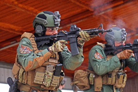 Rory Kennedy (on rifle) and Charles Hunt (on spotting scope) work together March 15 to identify a target during the SWAT Challenge at Fort Campbell, Ky. Kennedy and Hunt are both law enforcement officers with the Montgomery County (Tenn.) Sheriff’s Office. The sniper marksmanship competition was the third of five events in the SWAT Challenge, this tested the physical, tactical and technical capabilities of multiple competing agencies. (Spc. Beverly Roche, 40th Public Affairs Detachment)