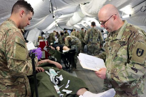 BACH Soldiers joined Soldiers from the Fort Campbell-based 586th Field Hospital for a training exercise, recently, aimed at readiness. A mass casualty drill, featuring role-players with realistic-looking wounds and injuries, tested the unit's ability to respond and triage patients to the appropriate level of care.  (U.S. Army photo by Maria Yager)