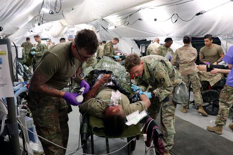 Medical teams are focused as Soldiers from BACH and the 586th Field Hospital respond to simulated casualties during a medical field training exercise on Fort Campbell recently. Medical teams were evaluated on their ability to accurately assess and triage simulated casualties to the appropriate level of care. The results can be used to tailor future training to support unit readiness. (U.S. Army photo by Maria Yager)