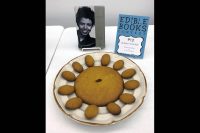 Several cookies and a single raisin represent Lorraine Hansberry’s play, “A Raisin in the Sun.”