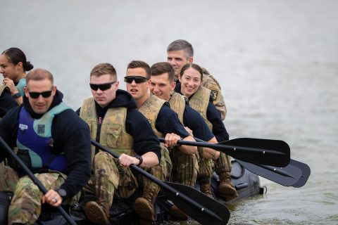 Austin Peay State University ROTC cadet Kylie Head smiles as she and her teammates propel a Zodiac boat at Liberty Park in Clarksville. (Benny Little, APSU)